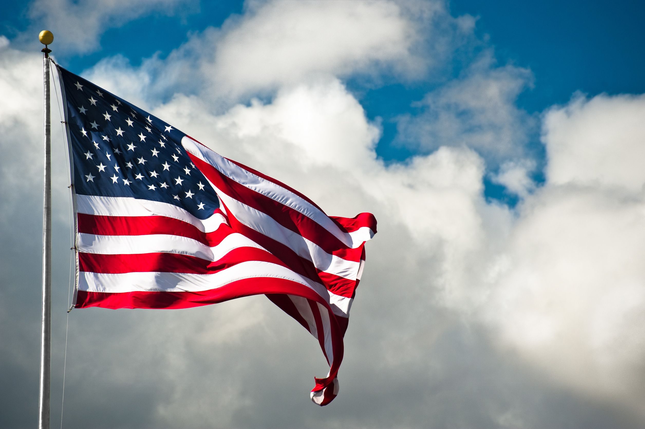 7498228 - american flag against a cloudy sky on a windy day - Advantage ...